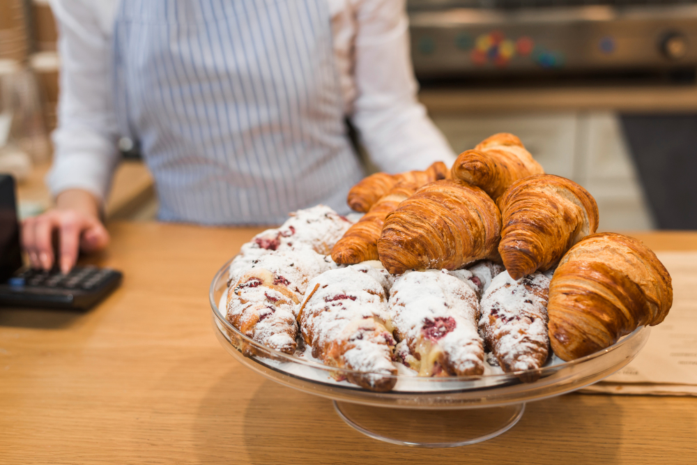 freshly-baked-croissant-cake-stand-counter-coffee-shop