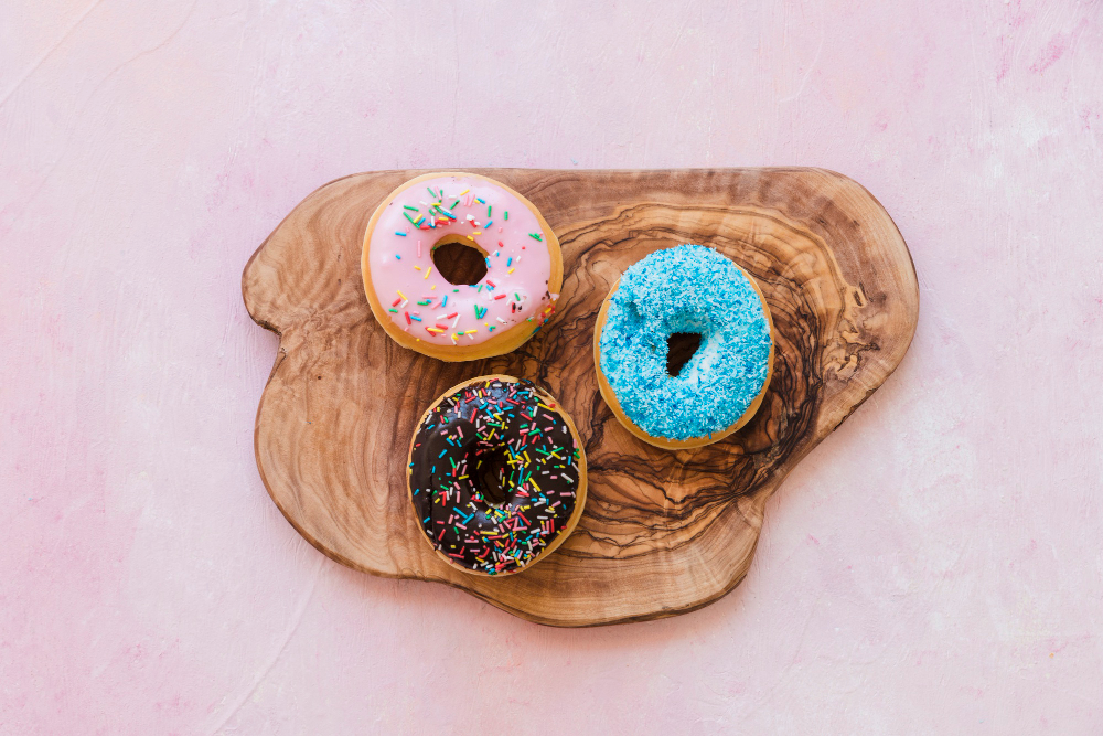 high-angle-view-tasty-donuts-wooden-chopping-board